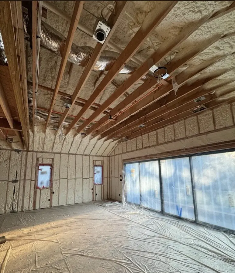 Interior walls and ceiling insulated with spray foam during new construction in Keyport